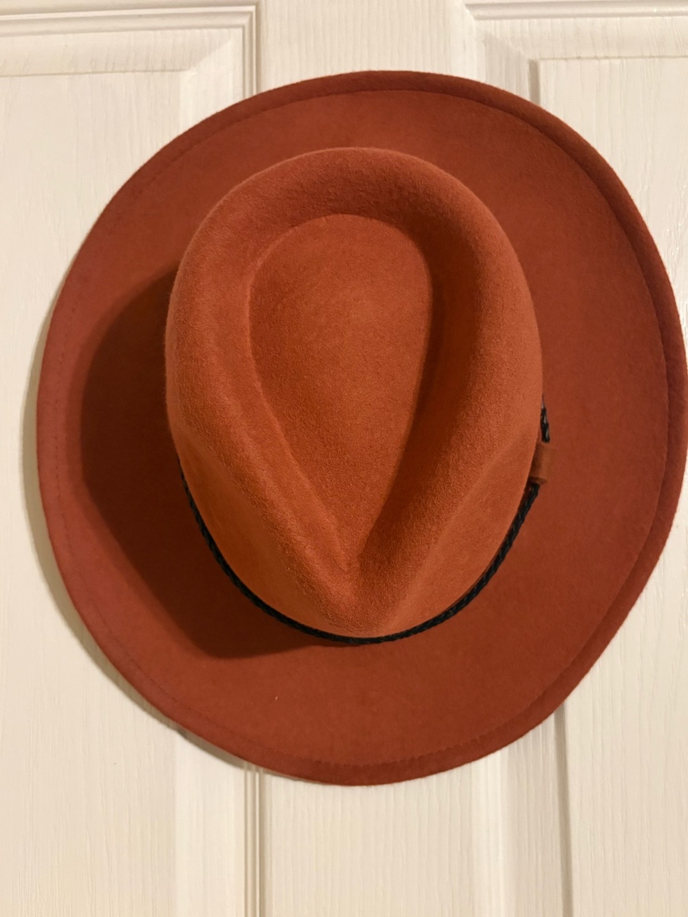 Burnt orange flat wide brim felt Fedora with black leather braided band